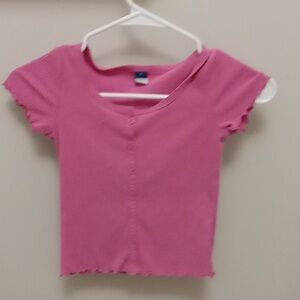 Light pink short sleeve shirt.